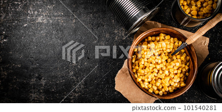 Canned corn on a wooden plate. Canned corn on a wooden plate. 101540281