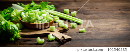 Sliced fresh celery on a cutting board. 101540285