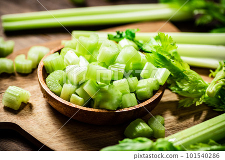 Sliced fresh celery on a cutting board. 101540286
