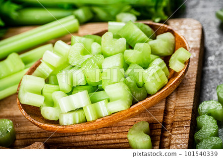 Sliced celery on a cutting board. 101540339