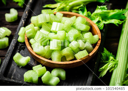 Sliced fresh celery. On a dark wooden background. 101540485