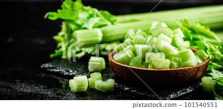 Pieces of fresh celery in a wooden plate. 101540551