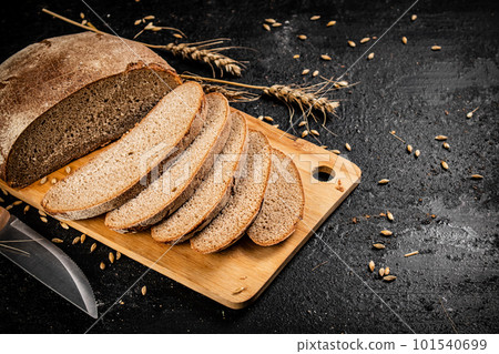Sliced rye bread on a cutting board. Sliced rye bread on a cutting board. 101540699