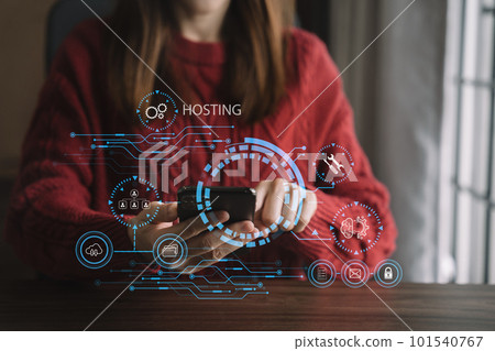 Woman using smartphone and presses his finger on the virtual screen inscription Hosting on desk, Web hosting concept, Internet, business, digital technology concept. 101540767