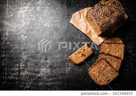 Sliced rye bread on paper. 101540855