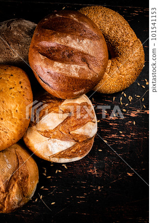 A variety of delicious bread on the table. 101541153
