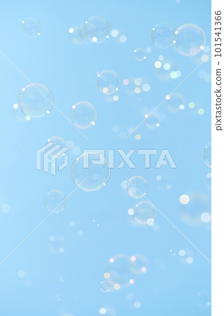 Soap bubbles dancing in the blue sky 101541366