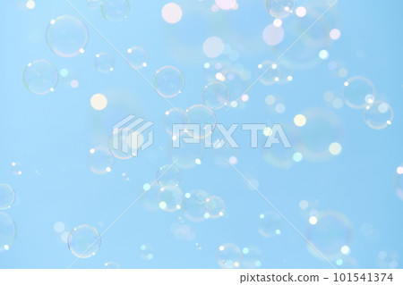 Soap bubbles dancing in the blue sky 101541374