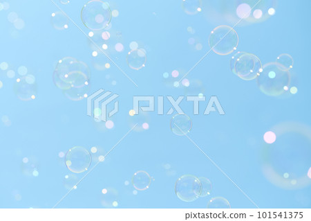 Soap bubbles dancing in the blue sky 101541375
