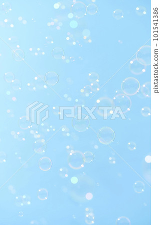 Soap bubbles dancing in the blue sky 101541386