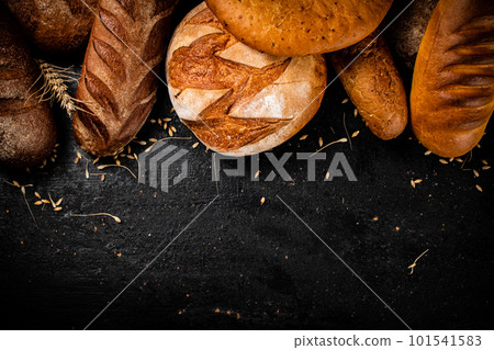 Different types of fresh bread on the table. 101541583