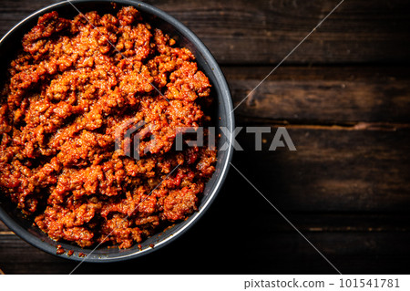 Bolognese sauce in a bowl on the table. Bolognese sauce in a bowl on the table. 101541781