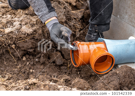 plastic pvc waste sewer pipe in the ground. construction site 101542339