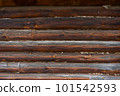 Wooden wall assembled of beams or logs. Log wall 101542593