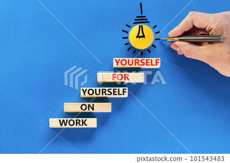 Work for yourself symbol. Concept words Work on yourself for yourself on wooden block. Beautiful blue table blue background. Businessman hand. Business and work for yourself concept. Copy space. 101543483