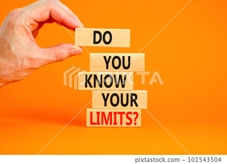 Do you know your limits symbol. Concept words Do you know your limits on wooden block. Beautiful orange table orange background. Businessman hand. Business do you know your limits concept. Copy space. Do you know your limits symbol. Concept words Do you know your limits on wooden block. Beautiful orange table orange background. Businessman hand. Business do you know your limits concept. Copy space. 101543504