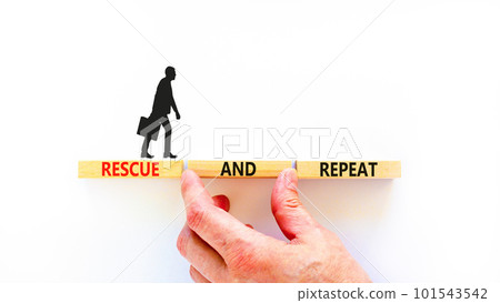 Rescue and repeat symbol. Concept words Rescue and repeat on wooden block on a beautiful white table white background. Businessman hand. Business rescue and repeat concept. Copy space. 101543542