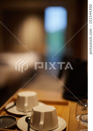 Scenery of a coffee set placed on a table in a hotel room Scenery of a coffee set placed on a table in a hotel room 101544300
