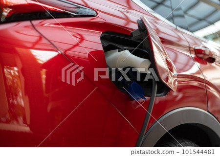Charging a red PHEV car 101544481