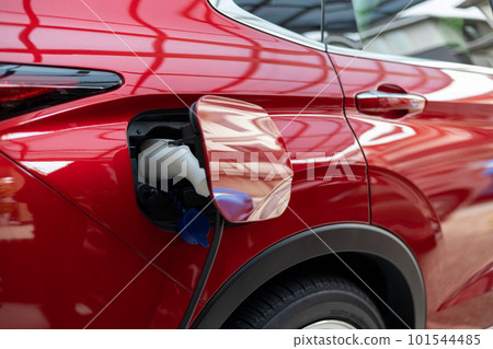 Charging a red PHEV car 101544485