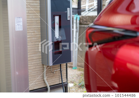 Charging a red PHEV car 101544486