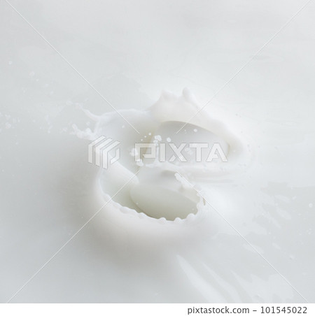 Cosmetic container white lotion droplet fly splashing. Milk lotion pour float to cosmetic bottle. Moisturizer lotion explosion spill. White background isolated high speed shutter freeze top view 101545022