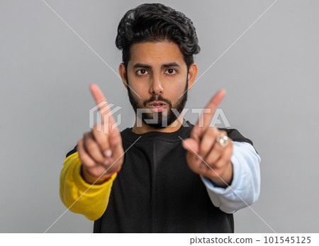 Indian handsome man shakes finger and saying no, be careful, avoid danger mistake, disapproval sign 101545125