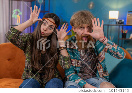 Family marriage couple man woman making silly facial expressions, fooling around showing tongue Family marriage couple man woman making silly facial expressions, fooling around showing tongue 101545143