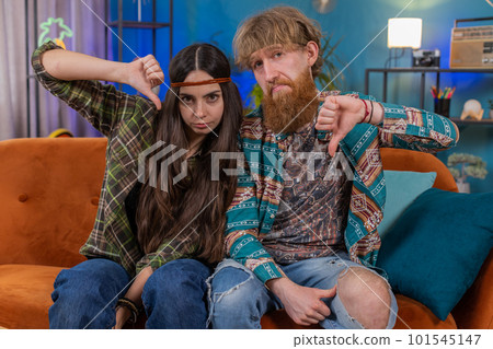 Upset family marriage couple showing thumbs down, dislike bad work disapproval dissatisfied feedback Upset family marriage couple showing thumbs down, dislike bad work disapproval dissatisfied feedback 101545147