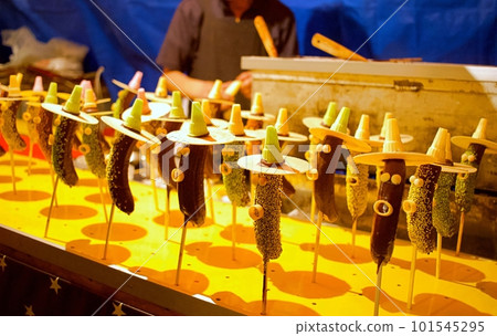 Chocolate bananas sold at festival stalls Chocolate bananas sold at festival stalls 101545295