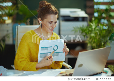 business owner woman having video conference and showing charts 101545336
