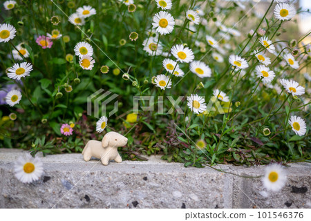 White cute flower and unglazed pottery dog figurine 101546376