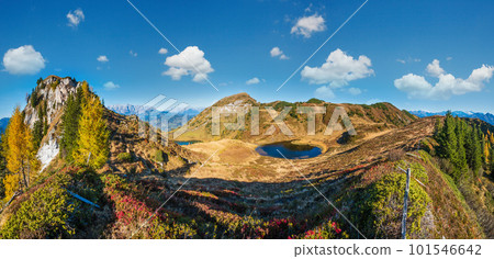 Autumn alpine Paarsee or Paarseen lakes, Land Salzburg, Austria. Alps Hochkonig rocky mountain group view in far. Autumn alpine Paarsee or Paarseen lakes, Land Salzburg, Austria. Alps Hochkonig rocky mountain group view in far. 101546642