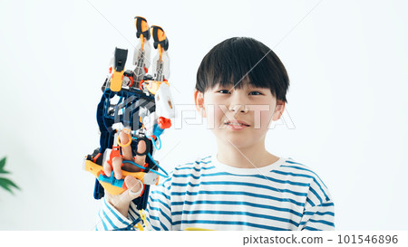 boy playing with robot hand boy playing with robot hand 101546896