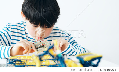 boy doing electronic work boy doing electronic work 101546904