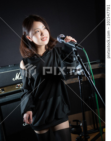 Young woman photographing in recording studio Young woman photographing in recording studio 101547701