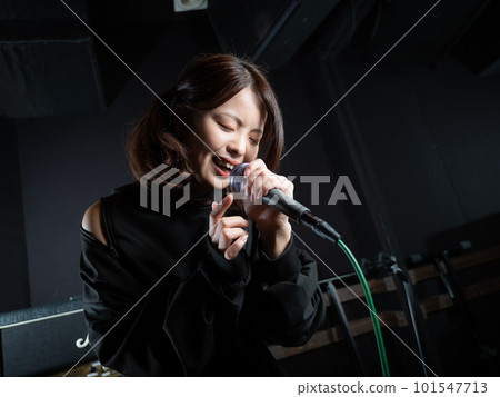 Young woman photographing in recording studio 101547713