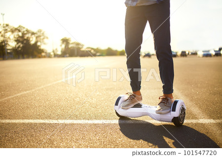 Young man riding on the Hoverboard in the park. content technologies. a new movement. Self Balancing Electric. Young man riding on the Hoverboard in the park. content technologies. a new movement. Self Balancing Electric. 101547720