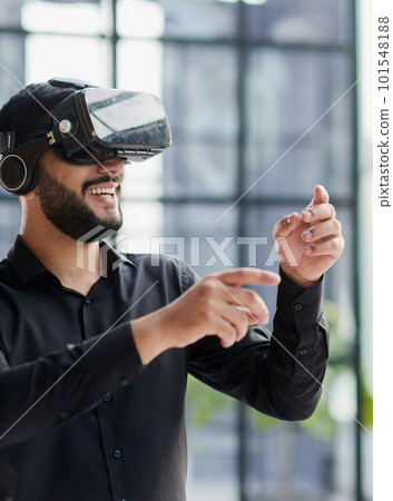 Businessman in virtual reality glasses or headset Businessman in virtual reality glasses or headset 101548188