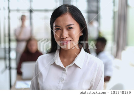Young beautiful Asian business woman consultant , portrait of an employee looking at the camera Young beautiful Asian business woman consultant , portrait of an employee looking at the camera 101548189