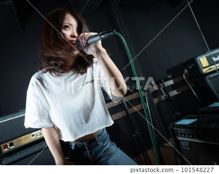 Young woman photographing in recording studio 101548227