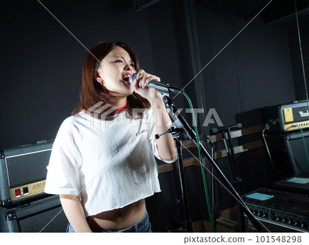 Young woman photographing in recording studio 101548298