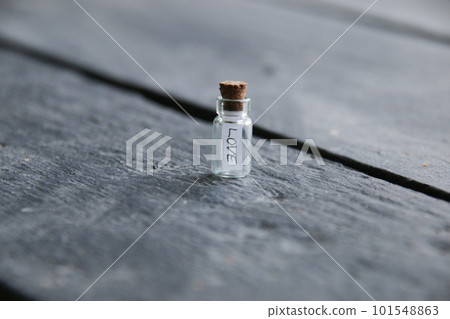 Love concept. A bottle with the inscription love. Vintage style. 101548863