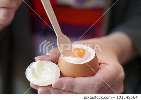Kinosaki Onsen town A woman's hand holding a hot spring egg in the shell 101549564