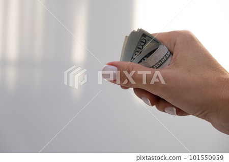 American dollars on women's hands. banking crisis. cash. one hundred bucks American dollars on women's hands. banking crisis. cash. one hundred bucks 101550959