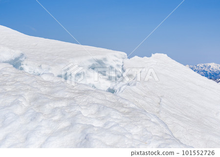 Near the summit of Mt. Tanigawa in the remaining snow season, snow cornices that are about to collapse (avalanche danger) Near the summit of Mt. Tanigawa in the remaining snow season, snow cornices that are about to collapse (avalanche danger) 101552726