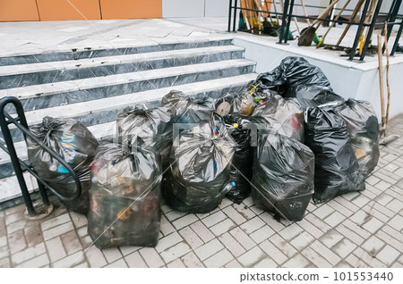 Garbage bags on the sidewalk Garbage bags on the sidewalk 101553440