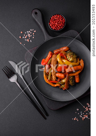 Mix of vegetables corn, carrots, peppers, broccoli, onions in teriyaki sauce 101553493