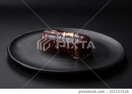 Delicious sweet cheese with syrup covered with chocolate and nuts Delicious sweet cheese with syrup covered with chocolate and nuts 101553526