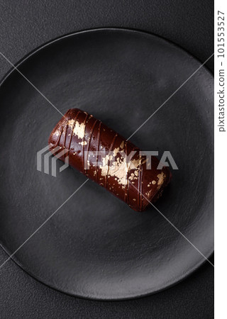 Delicious sweet cheese with syrup covered with chocolate and nuts Delicious sweet cheese with syrup covered with chocolate and nuts 101553527